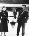 This 1937 photo shows Jack Milford of the Wembley Monarchs skating with his wife and... Their baby strapped up between them.
