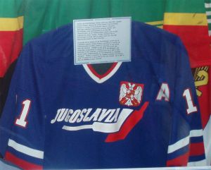 a blue jersey in a glass display case